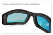 Close-up of black protective sports goggles with blue lenses and foam cushioning
