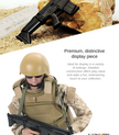Military-style action figure with miniature rifles shown as a collectible display piece
